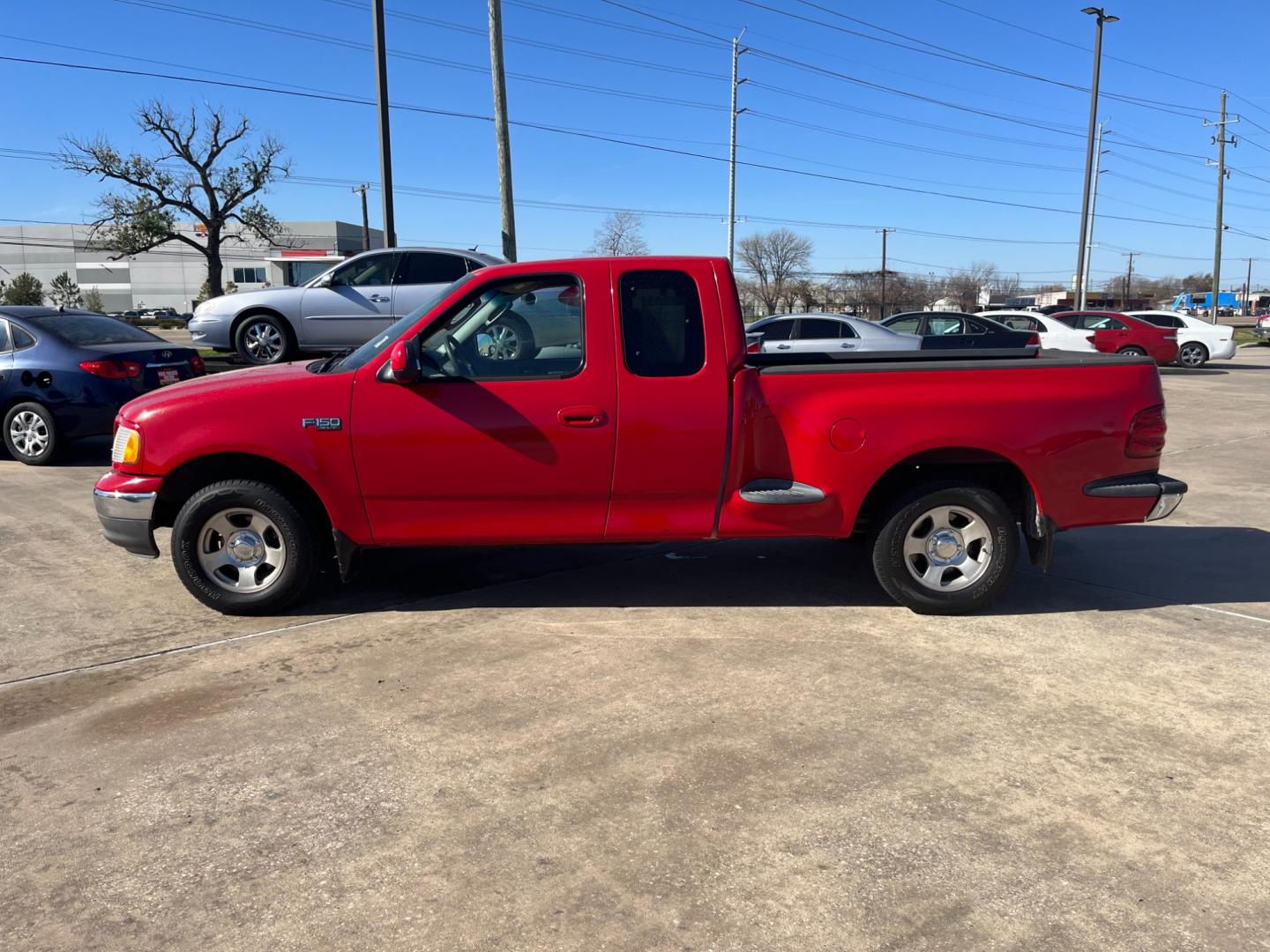 2003 red /TAN Ford F-150 XL SuperCab Flareside 2WD (1FTRX07213K) with an 4.2L V6 OHV 12V engine, Automatic transmission, located at 14700 Tomball Parkway 249, Houston, TX, 77086, (281) 444-2200, 29.928619, -95.504074 - Photo#3